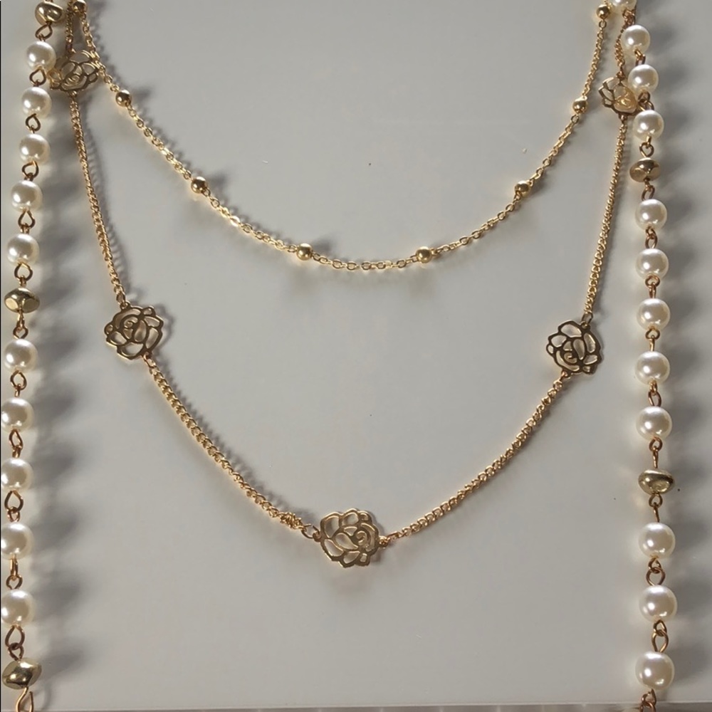 Layered pearl necklace.
